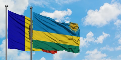 Moldova and Rwanda flag waving in the wind against white cloudy blue sky together. Diplomacy concept, international relations.