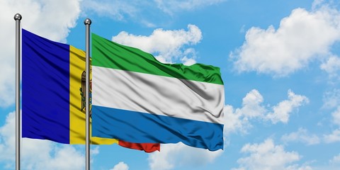 Moldova and Sierra Leone flag waving in the wind against white cloudy blue sky together. Diplomacy concept, international relations.