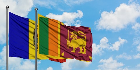 Moldova and Sri Lanka flag waving in the wind against white cloudy blue sky together. Diplomacy concept, international relations.