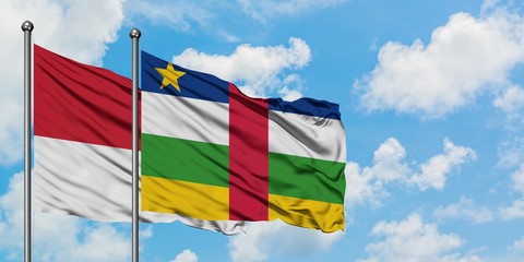 Monaco and Central African Republic flag waving in the wind against white cloudy blue sky together. Diplomacy concept, international relations.