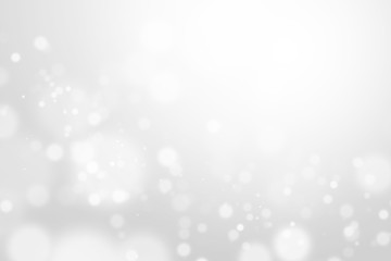 Bokeh abstract blurred silver and white beautiful background. Soft color light glitter sparkles. element for backdrop or design cosmetic ads, winter, christmas, luxury, beauty, baby