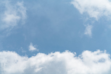White cloud and blue sky background with copy space