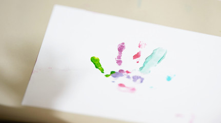 Hand and fingers print in art workspace