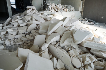 large pile of construction debris from foam blocks at the construction site