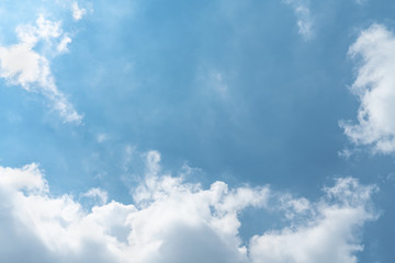 White cloud and blue sky background with copy space