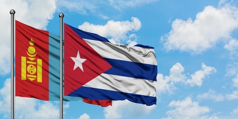 Mongolia and Cuba flag waving in the wind against white cloudy blue sky together. Diplomacy concept, international relations.
