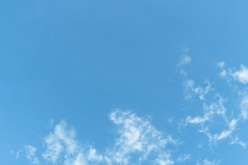White cloud and blue sky background with copy space