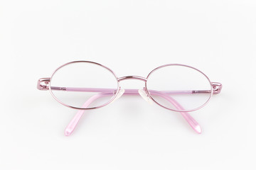 Pink eye glasses spectacles on white background. for reading daily life to a person with visual impairment.