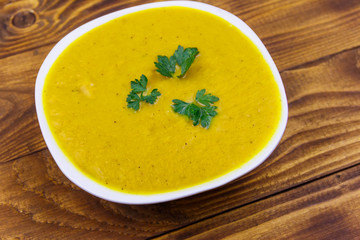 Pumpkin soup on a wooden table