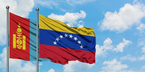 Mongolia and Venezuela flag waving in the wind against white cloudy blue sky together. Diplomacy concept, international relations.