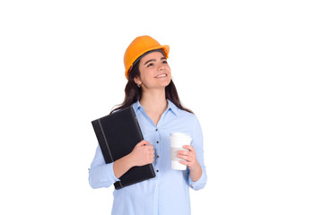 Female architect holding folders and blueprints.