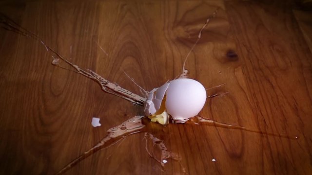 An egg falling and breaking open. Shot with a high-speed camera.