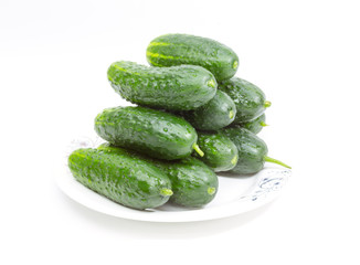 green cucumbers on a white background
