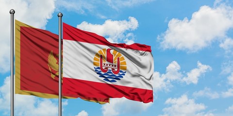 Montenegro and French Polynesia flag waving in the wind against white cloudy blue sky together. Diplomacy concept, international relations.