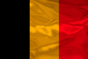 photograph of the beautiful colored national flag of the modern state of Germany on textured fabric, concept of tourism, economics and politics