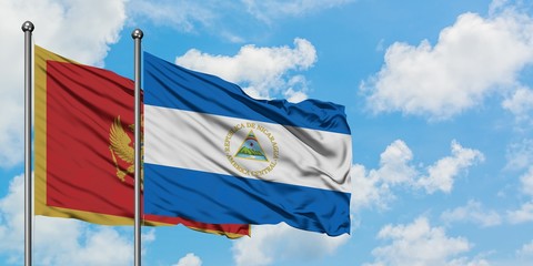 Montenegro and Nicaragua flag waving in the wind against white cloudy blue sky together. Diplomacy concept, international relations.