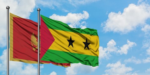 Montenegro and Sao Tome And Principe flag waving in the wind against white cloudy blue sky together. Diplomacy concept, international relations.