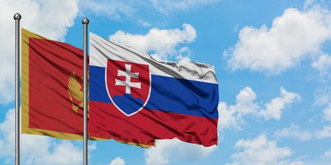 Montenegro and Slovakia flag waving in the wind against white cloudy blue sky together. Diplomacy concept, international relations.