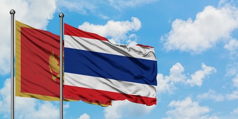 Montenegro and Thailand flag waving in the wind against white cloudy blue sky together. Diplomacy concept, international relations.