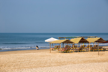 Sun umbrellas and chairs on beach