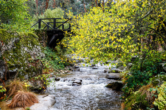 Eresma river as it passes through Boca del Asno among the granite rocks in Valsain, Segovia, Spain