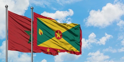 Morocco and Grenada flag waving in the wind against white cloudy blue sky together. Diplomacy concept, international relations.