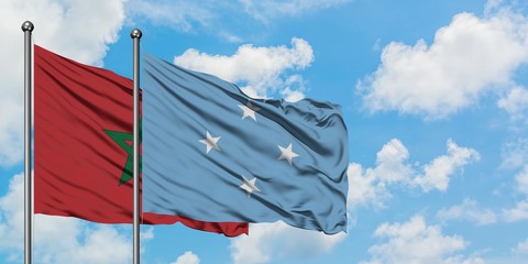 Morocco and Micronesia flag waving in the wind against white cloudy blue sky together. Diplomacy concept, international relations.