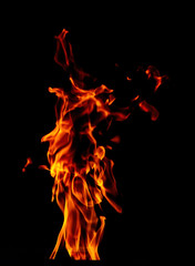Fire flame isolated on black background. Beautiful yellow, orange and red blaze flashes of fire.