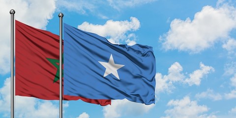 Morocco and Somalia flag waving in the wind against white cloudy blue sky together. Diplomacy concept, international relations.