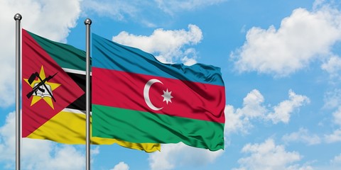 Mozambique and Azerbaijan flag waving in the wind against white cloudy blue sky together. Diplomacy concept, international relations.
