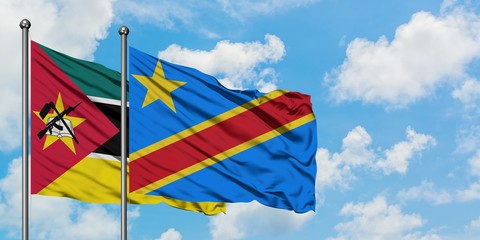 Mozambique and Congo flag waving in the wind against white cloudy blue sky together. Diplomacy concept, international relations.