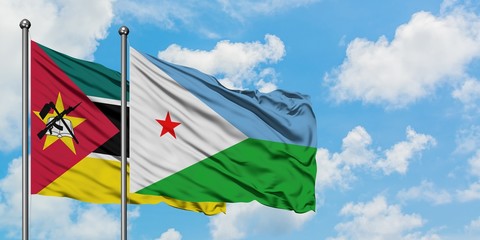 Mozambique and Djibouti flag waving in the wind against white cloudy blue sky together. Diplomacy concept, international relations.