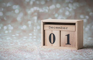 December 01, the first day of winter wooden calendar on a shiny background