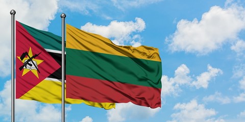 Mozambique and Lithuania flag waving in the wind against white cloudy blue sky together. Diplomacy concept, international relations.
