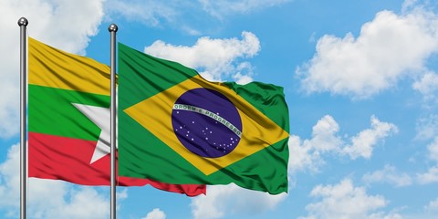 Myanmar and Brazil flag waving in the wind against white cloudy blue sky together. Diplomacy concept, international relations.