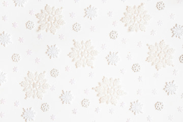 Christmas composition. Pattern made of white snowflakes on white background. Christmas, winter, new...