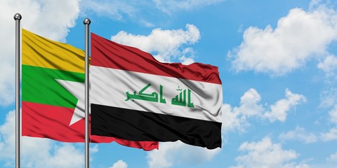 Myanmar and Iraq flag waving in the wind against white cloudy blue sky together. Diplomacy concept, international relations.