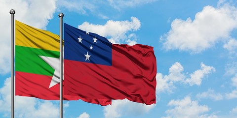 Myanmar and Samoa flag waving in the wind against white cloudy blue sky together. Diplomacy concept, international relations.