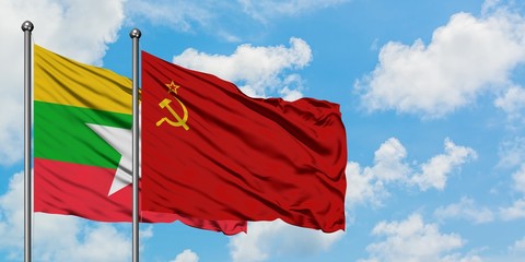 Myanmar and Soviet Union flag waving in the wind against white cloudy blue sky together. Diplomacy concept, international relations.