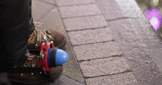 Tambourine on a street musician s boot