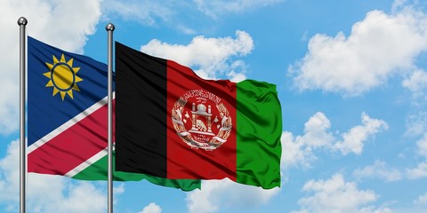 Namibia and Afghanistan flag waving in the wind against white cloudy blue sky together. Diplomacy concept, international relations.
