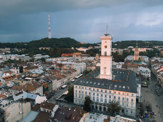 Fototapeta na wymiar aerial view of lviv bell clock tower on sunset overcast sky
