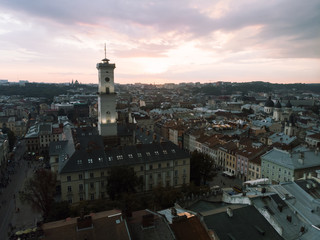Obraz premium aerial view of lviv bell clock tower on sunset overcast sky