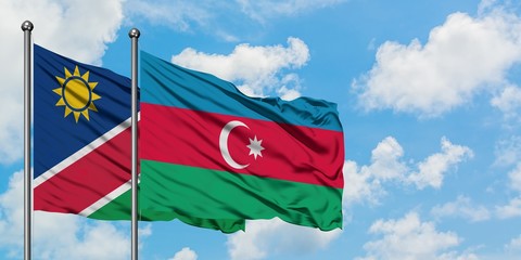 Namibia and Azerbaijan flag waving in the wind against white cloudy blue sky together. Diplomacy concept, international relations.