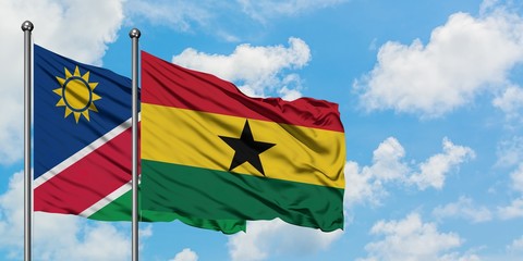 Namibia and Ghana flag waving in the wind against white cloudy blue sky together. Diplomacy concept, international relations.