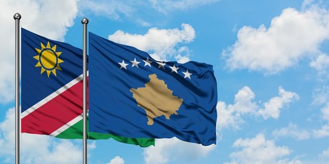 Namibia and Kosovo flag waving in the wind against white cloudy blue sky together. Diplomacy concept, international relations.