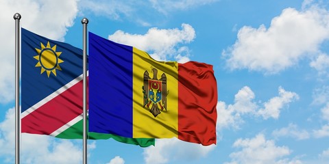 Namibia and Moldova flag waving in the wind against white cloudy blue sky together. Diplomacy concept, international relations.