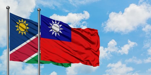 Namibia and Taiwan flag waving in the wind against white cloudy blue sky together. Diplomacy concept, international relations.