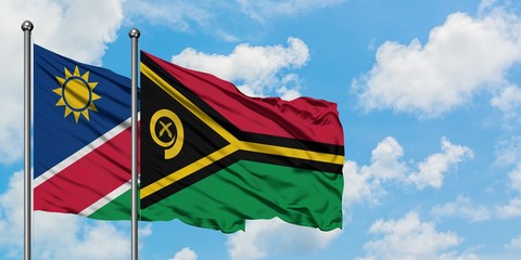 Namibia and Vanuatu flag waving in the wind against white cloudy blue sky together. Diplomacy concept, international relations.