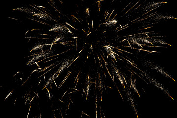 Fireworks sparkles in the night sky as background